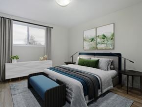 Kitchener apartment for rent - A bedroom with a large bed and a window with curtains.