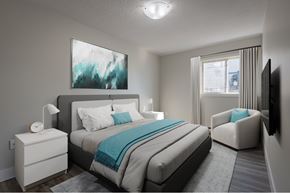 Halifax apartment for rent - A bedroom with a large bed and a painting on the wall.