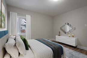 Halifax apartment for rent - A bedroom with a large bed and a white dresser.