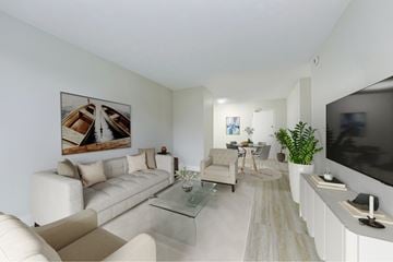 Cambridge apartment for rent - A living room with a white couch, a glass coffee table, and a painting on the wall.
