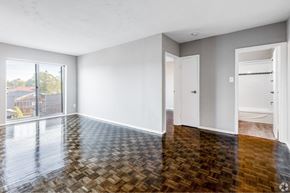 Hamilton apartment for rent - A room with a wooden floor and white walls.