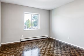 Hamilton apartment for rent - A room with a checkered floor and a window.