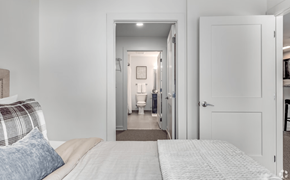 Damascus apartment for rent - A bedroom with a bed and a mirror in the hallway.
