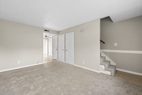 Summerville apartment for rent - A room with a staircase and two doors.