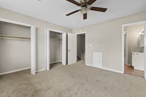 Summerville apartment for rent - A room with a ceiling fan and carpeted floor.