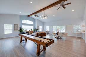 Savannah apartment for rent - A spacious room with a long wooden table and chairs at Retreat at Savannah Apartments, Savannah, GA, 31404