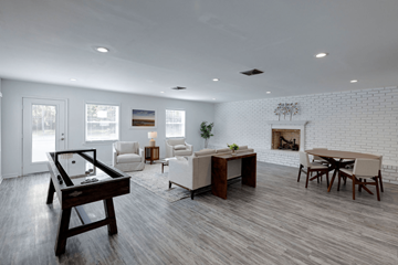 Savannah apartment for rent - A modern living room with a pool table and a fireplace.