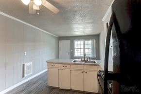 Perry apartment for rent - A kitchen with a sink and white cabinets.