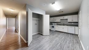 Hawkinsville apartment for rent - A kitchen with white cabinets and a grey floor.