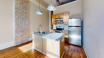 Macon apartment for rent - A kitchen with a sink and a refrigerator.