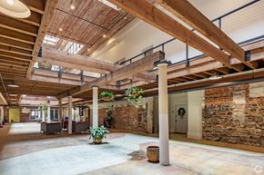 Macon apartment for rent - A large open space with a high ceiling and wooden beams.