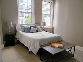 Evansville apartment for rent - a small bedroom with a bed and a coffee table
