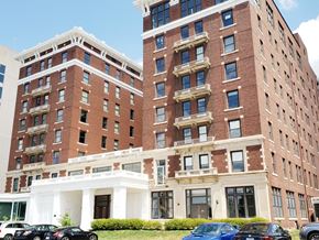 Evansville apartment for rent - a large brick building with cars parked in front of it