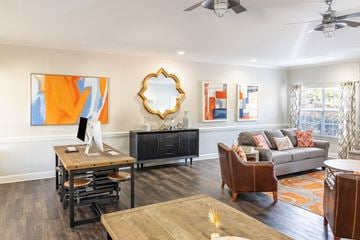 Auburn apartment for rent - A living room with a brown wooden table and a black cabinet.