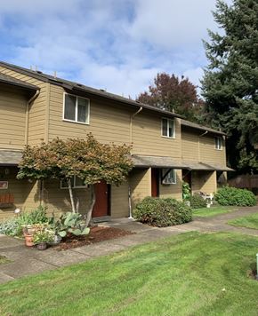 Eugene apartment for rent - A house with a red door and a tree in front.