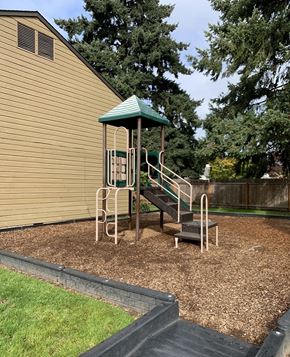 Eugene apartment for rent - A playground with a green roof and a slide.