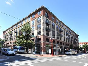 Portland apartment for rent - A red brick building with a tree in front of it.