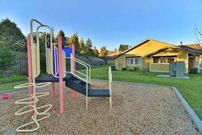 Jackson apartment for rent - A playground with a slide and monkey bars.
