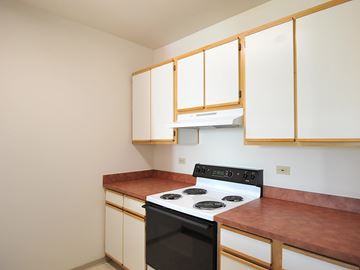 Portland apartment for rent - A kitchen with a stove and cabinets.