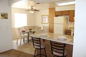 Perris apartment for rent - A kitchen with a table and chairs.
