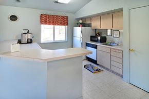 Truckee apartment for rent - A kitchen with a white counter top and a refrigerator.