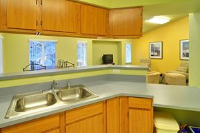 Grass Valley apartment for rent - A kitchen with a sink and wooden cabinets.