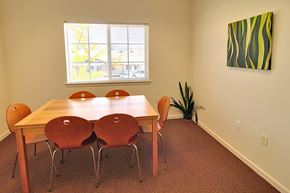 Grass Valley apartment for rent - A dining room with a wooden table and chairs.