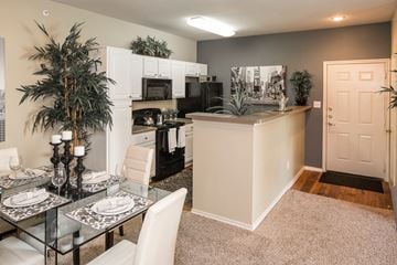 Mesquite apartment for rent - A modern kitchen with a glass table set for two.