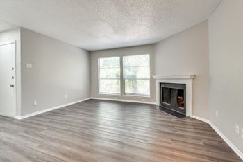 A room with a fireplace and a window.