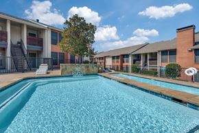 Dallas apartment for rent - A swimming pool in front of apartment buildings at Infinity on the Oaks Apartments , Dallas, TX, 75231