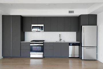 Los Angeles apartment for rent - A modern kitchen with a stainless steel refrigerator and oven.