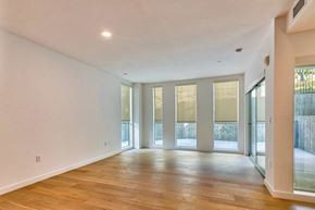 Los Angeles apartment for rent - A spacious room with wooden floors and large windows.at 1048 Manzanita, Los Angeles, CA 90029