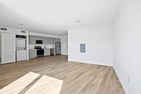 Santa Monica apartment for rent - A kitchen area with a refrigerator, oven, and microwave.at The Wilson, California