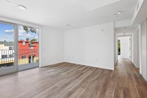 Santa Monica apartment for rent - A spacious room with wooden flooring and white walls.at The Wilson, California, 90405
