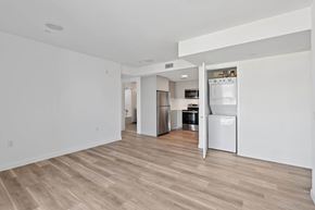 Santa Monica apartment for rent - A kitchen with white appliances and wooden floors.at The Wilson, Santa Monica, CA 90405