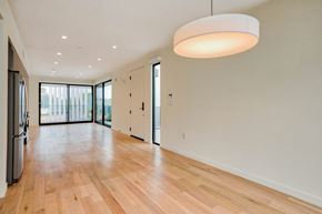 Santa Monica apartment for rent - A spacious room with wooden floors and a large window.at 810 Ashland, Santa Monica California