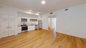 Los Angeles apartment for rent - A kitchen with white cabinets and a wooden floor.at The Dillon II at Silver Lake, California