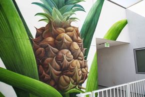 Los Angeles apartment for rent - A pineapple mural on the side of a building.at Junction 4121, Los Angeles, CA