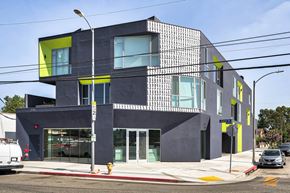 Los Angeles apartment for rent - A modern building with a black and yellow exterior.at 5135 W Adams, California