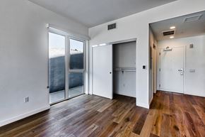 Los Angeles apartment for rent - A room with wooden floors and white walls.at 5263 W Adams, California