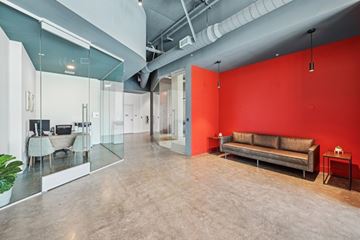 Los Angeles apartment for rent - A modern living room with a glass table and a couch.