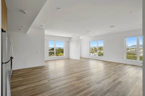 Los Angeles apartment for rent - A spacious room with wooden floors and white walls.at 2221 S Western, Los Angeles, CA 90018