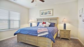 Little River apartment for rent - A bedroom with a bed, two lamps, and a ceiling fan at Stepping Stone at Bridgewater Apartments, Little River