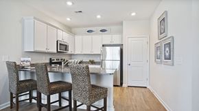 Little River apartment for rent - A kitchen with a table and chairs at Stepping Stone at Bridgewater Apartments, Little River, SC