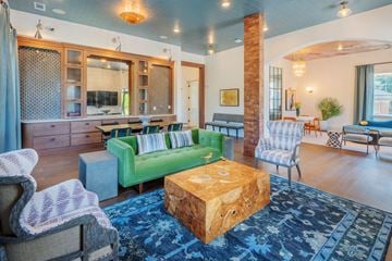 Belmont apartment for rent - A living room with a green couch and a wooden coffee table.