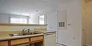 Triangle apartment for rent - A kitchen with a sink and a window.