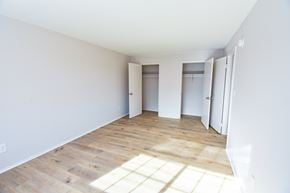 Manassas apartment for rent - A room with wooden floors and white walls.