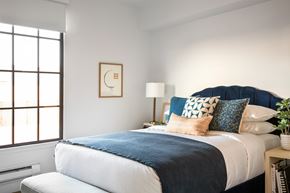 San Francisco apartment for rent - A bedroom with a large bed and a window.