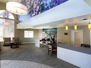 Huntington Beach apartment for rent - A spacious waiting room with a large mural on the wall.