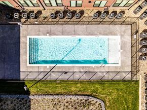 Nashville apartment for rent - A rectangular pool with a diving board on the side.